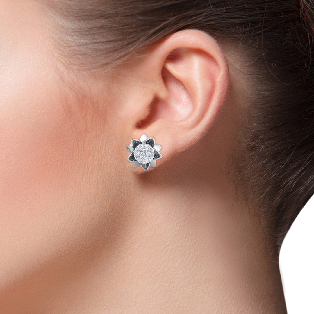 Flower shaped stud earrings in white gold with white diamonds of 0.62 ct in weight